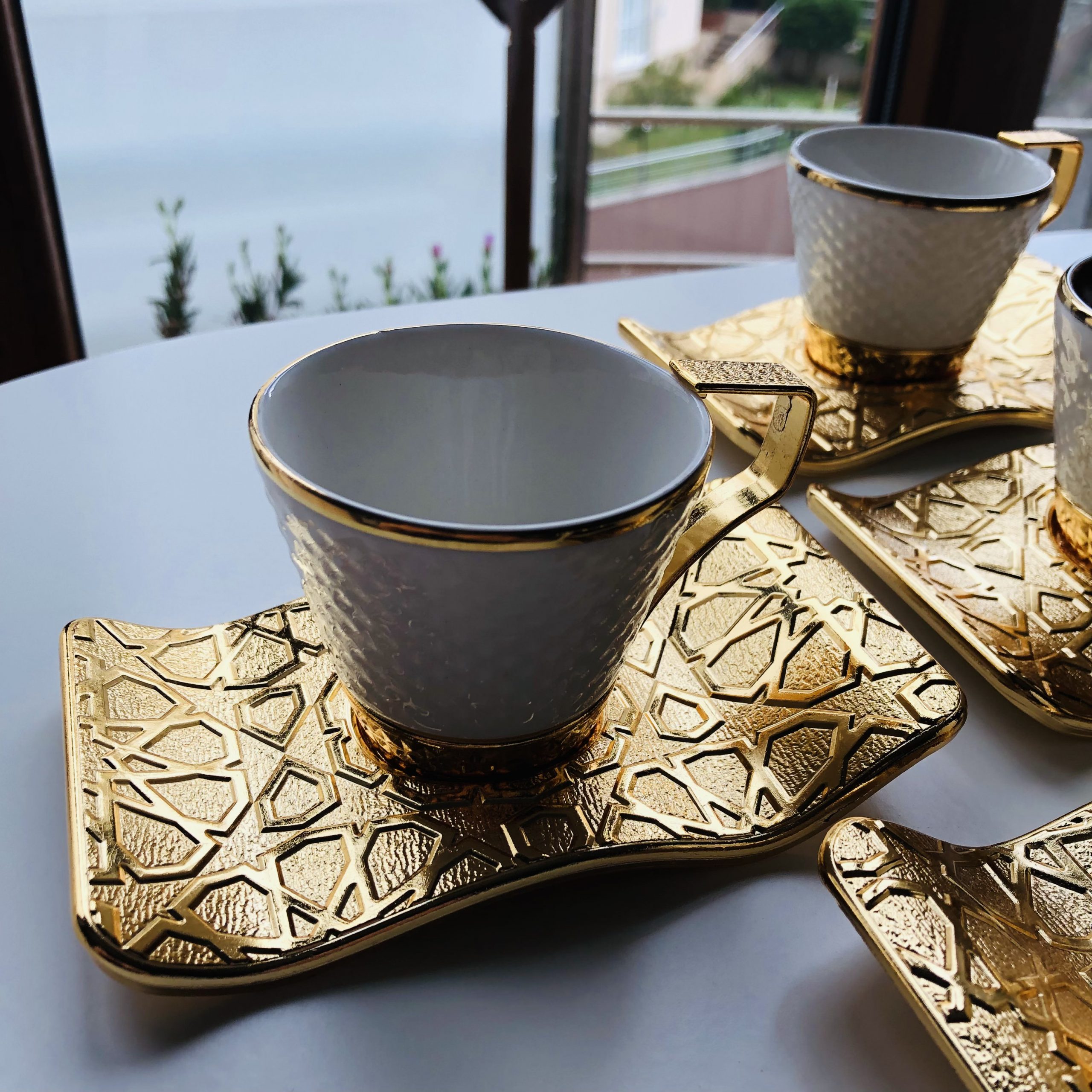 https://traditionalturk.com/wp-content/uploads/2021/05/luxury-gold-color-turkish-coffee-cup-set-for-six-person-3-scaled.jpeg